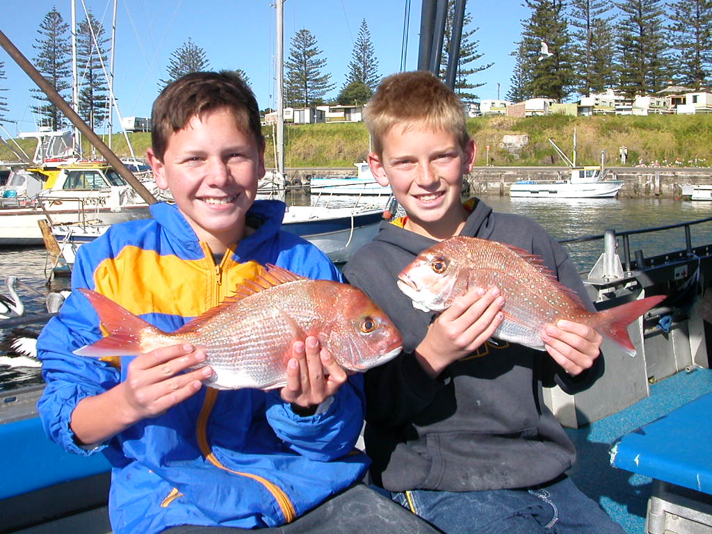 Two young anglers with fresh snapper at Kiama Harbour